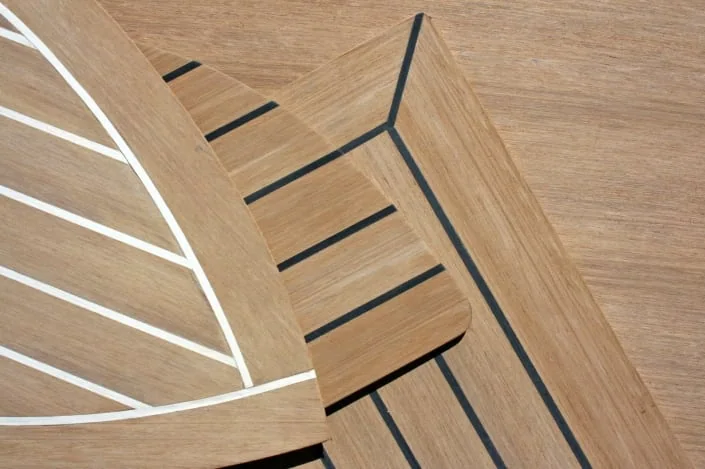 Rigid synthetic marine decking co-extruded to look and feel like real teak