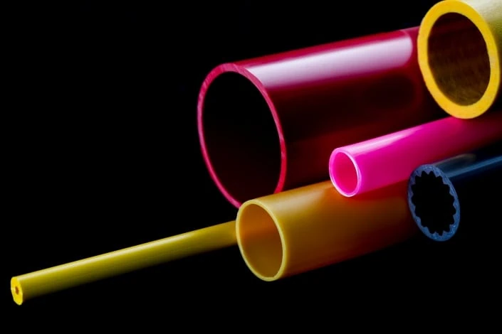 pink and yellow coloured rigid plastic tubes