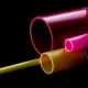 pink and yellow coloured rigid plastic tubes